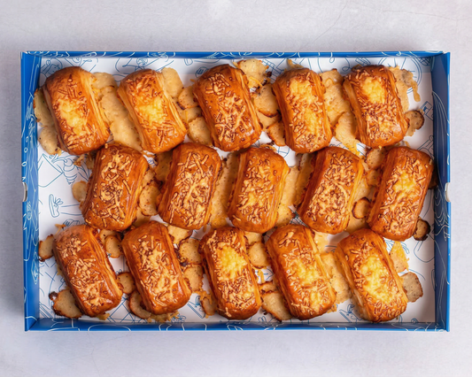A box of Bakehouse Occasions mini parmesan cheese danishes, perfect for breakfast meetings, parties, and corporate catering.