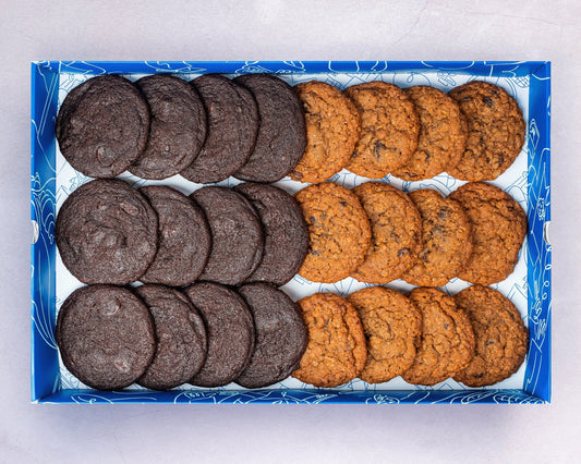 A Box of bakehouse occasions mini double chocolate and apple and raisin cookies.