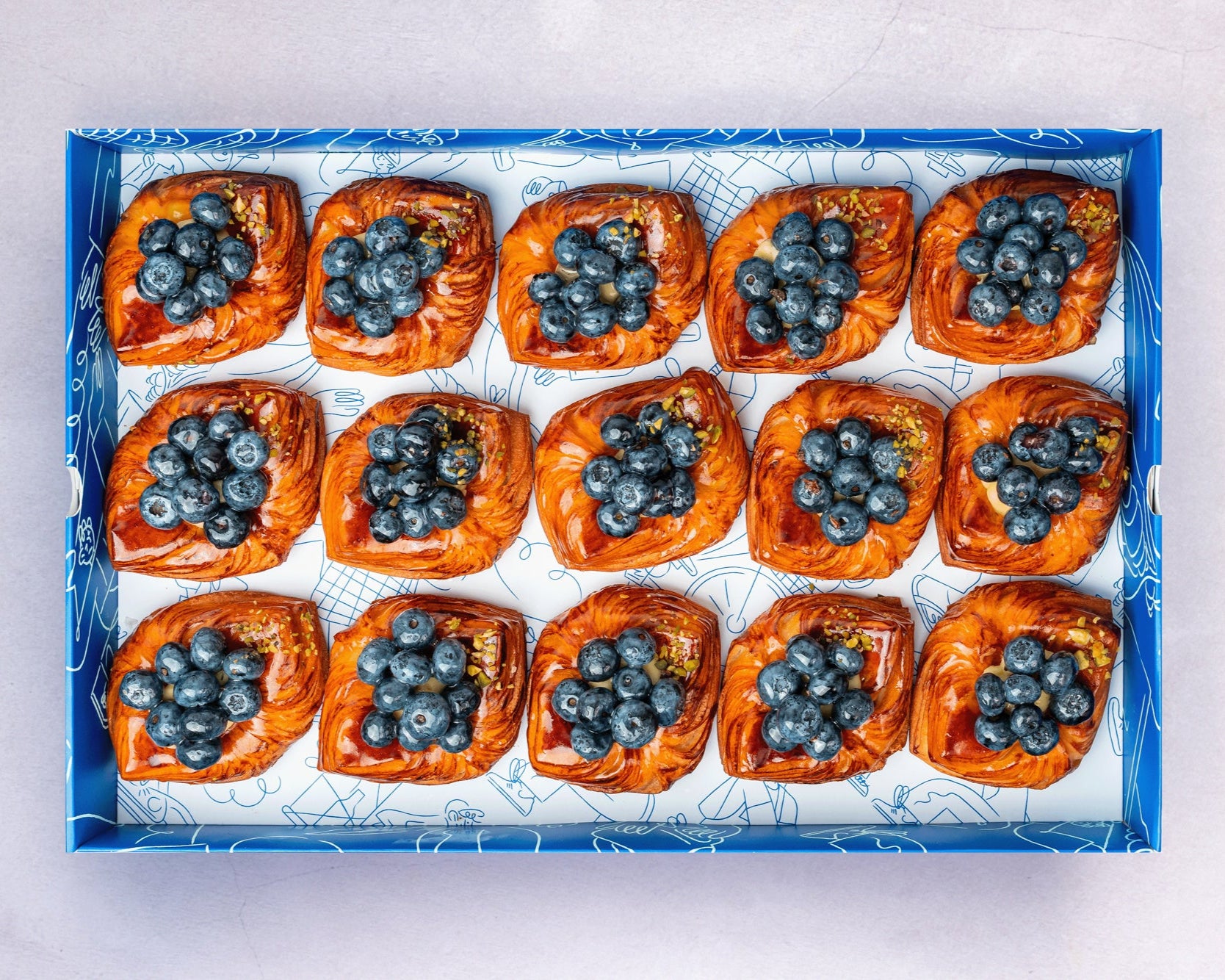 A Box of Bakehouse Occasions mini blueberry danish, prefect for afternoon treats and event catering.
