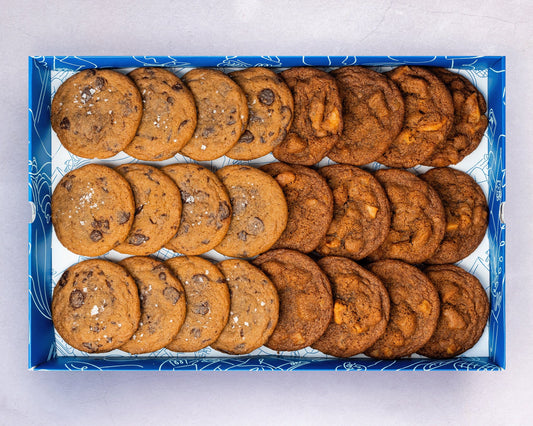 A Box of bakehouse occasions mini chocolate sea salt and apple pie cookies.