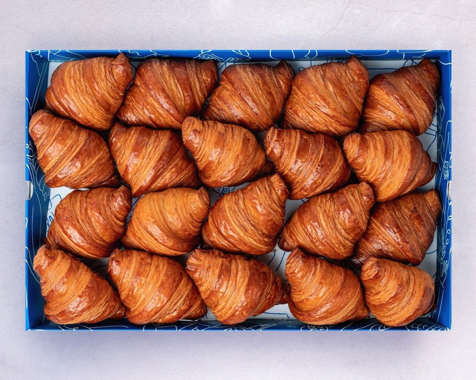 Bakehouse Occasions catering box of our popular mini, flaky, buttery croissants.