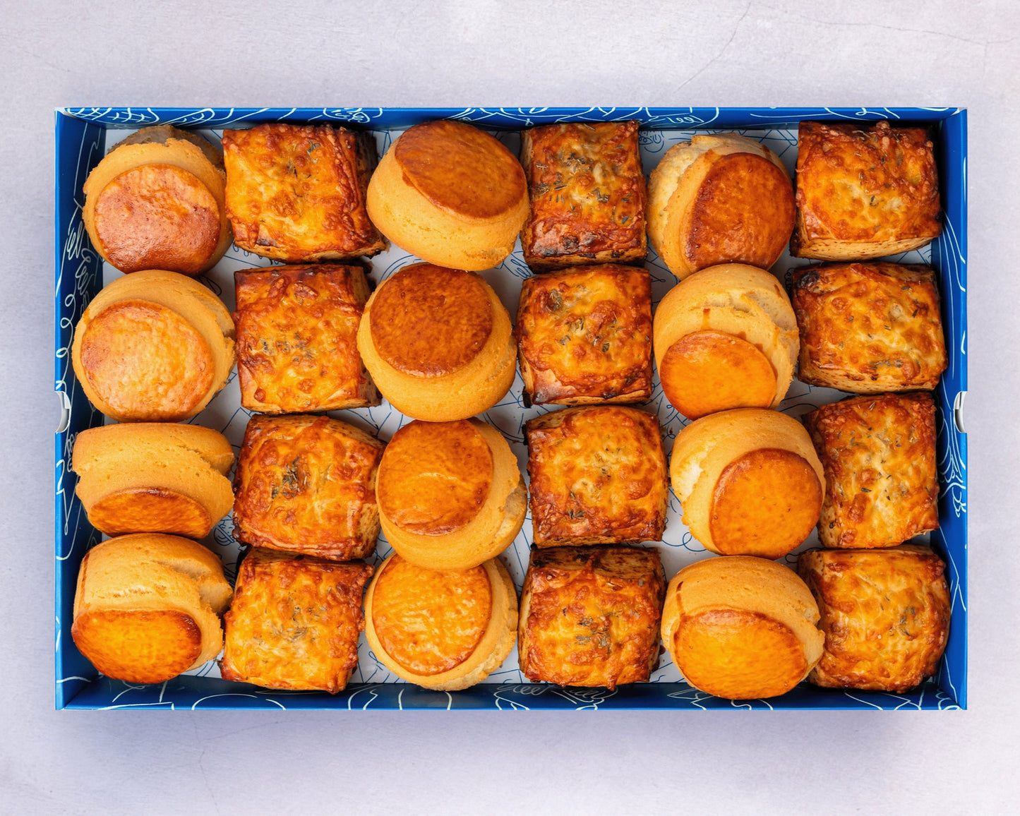 Bakehouse Occasions offers a catering scone box with selection of plain, apple raisin, and cheese & onion scones.