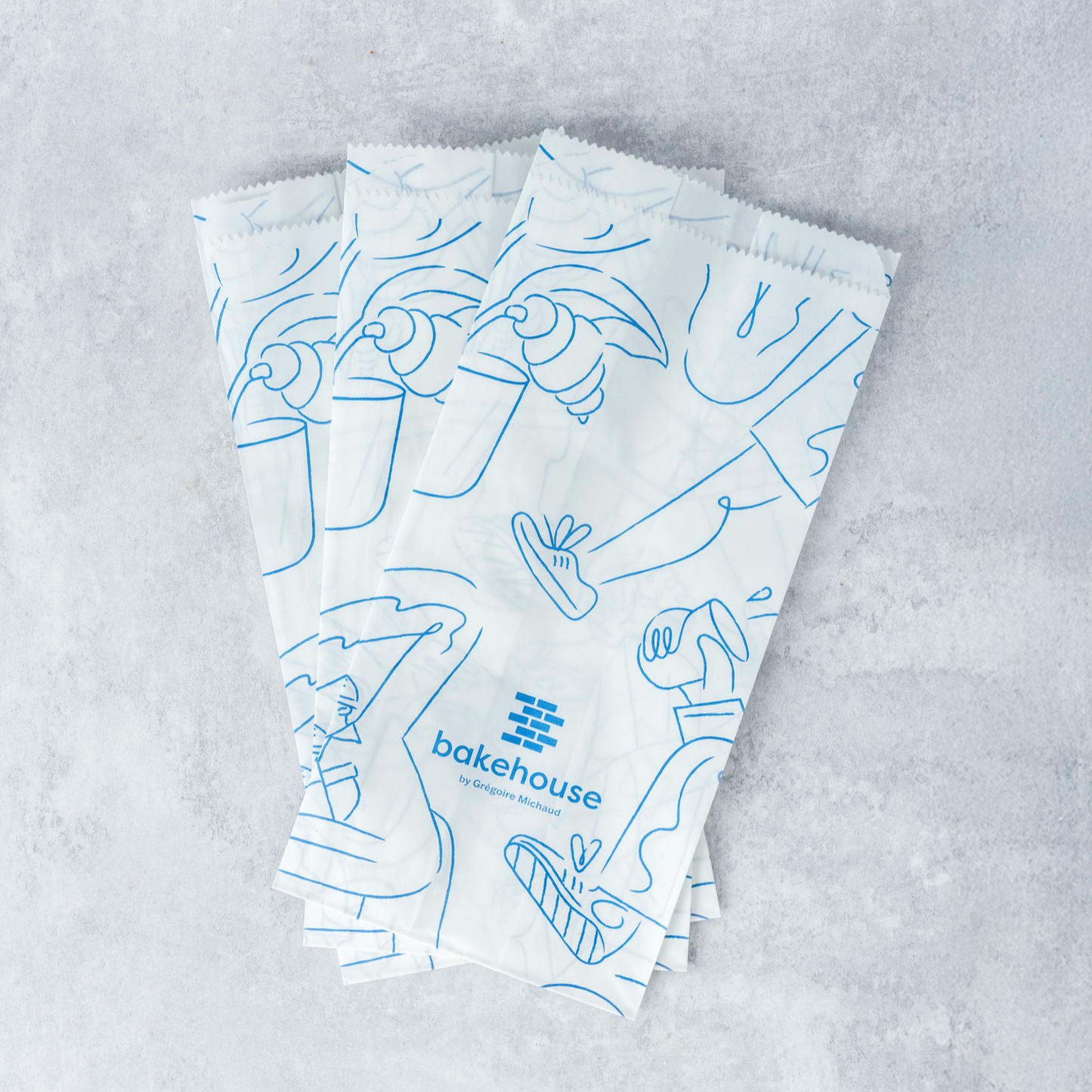 three bakehouse paper pastry bags for takeaways.