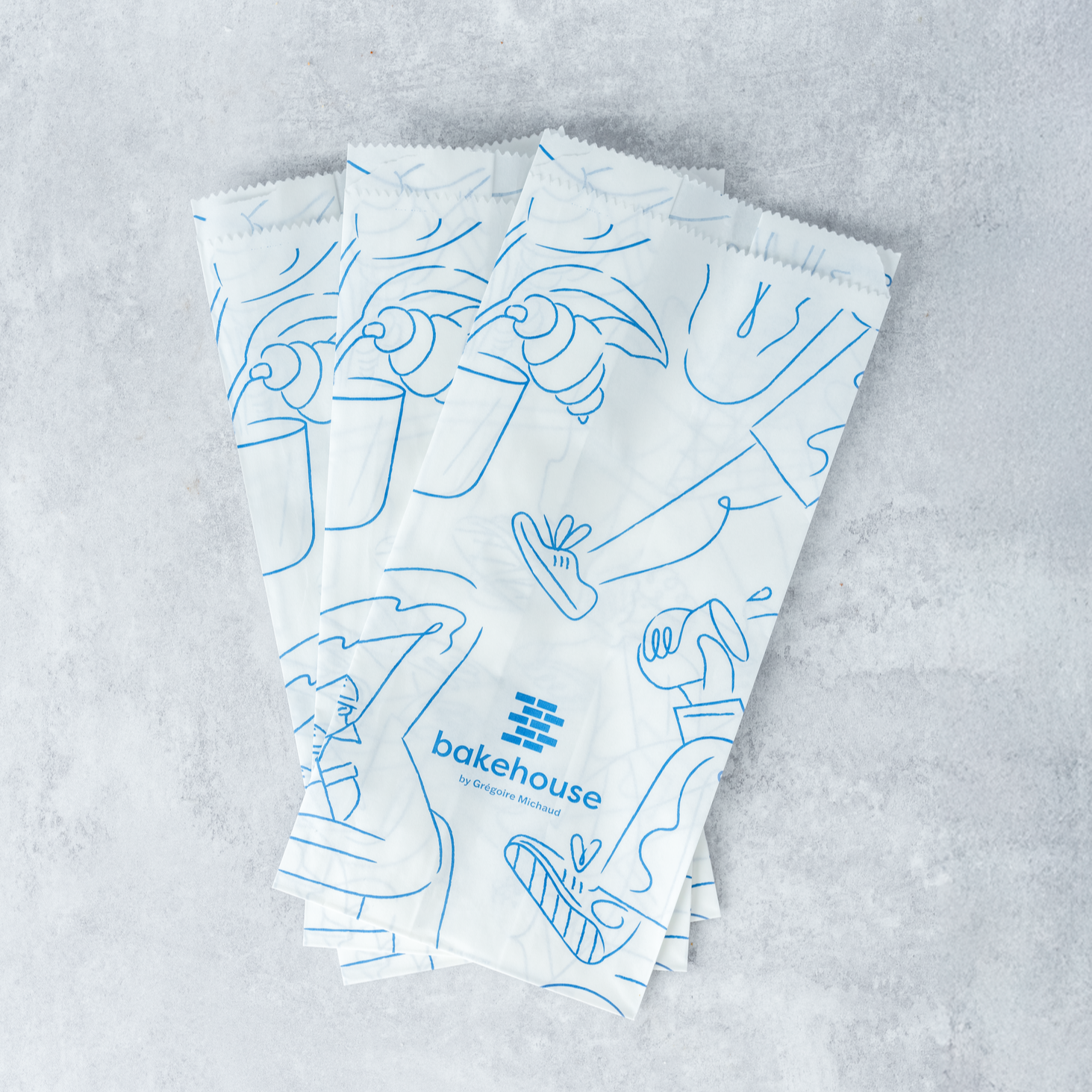 three bakehouse paper pastry bags for takeaways.