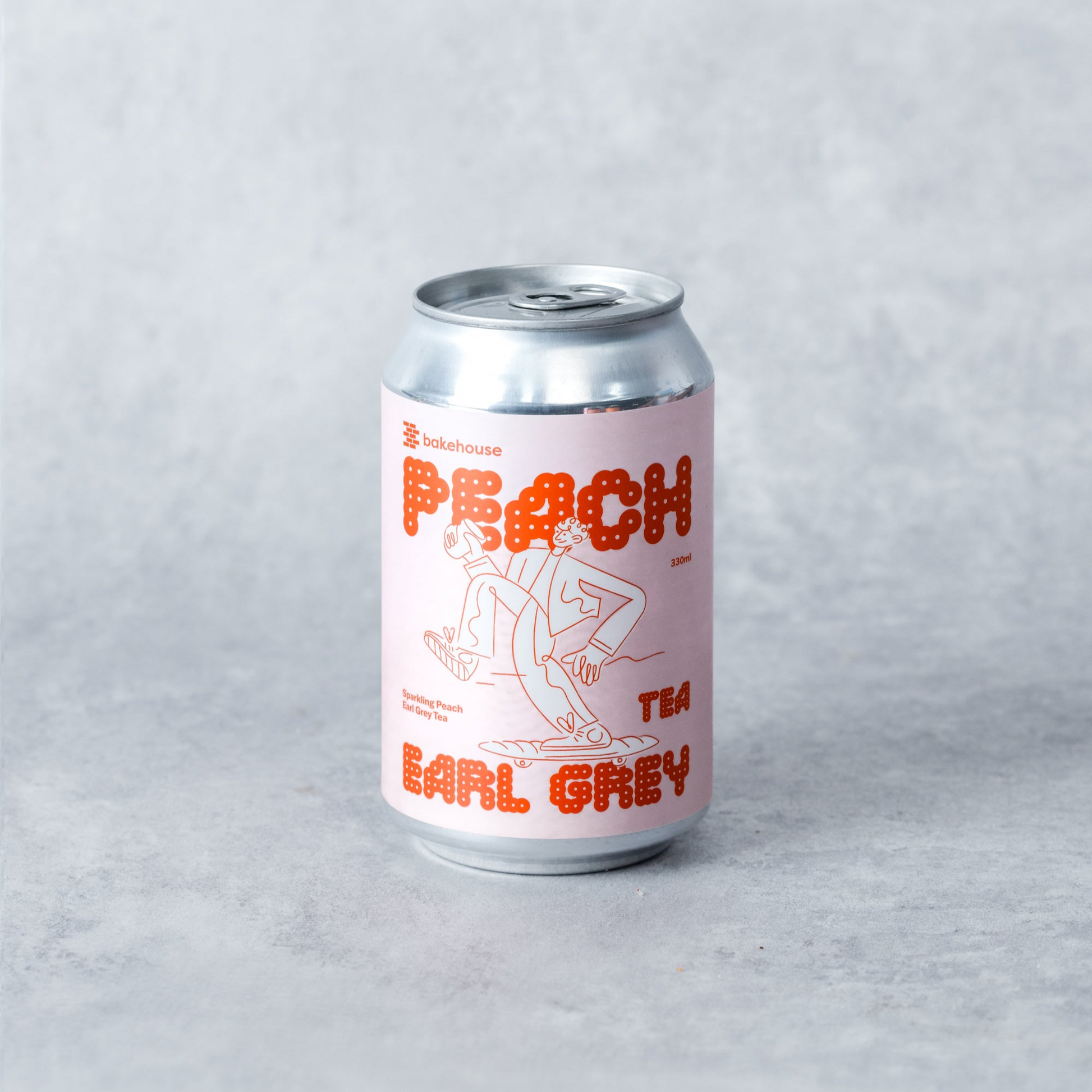 A can of Bakehouse Sparkling Peach Earl Grey Tea.